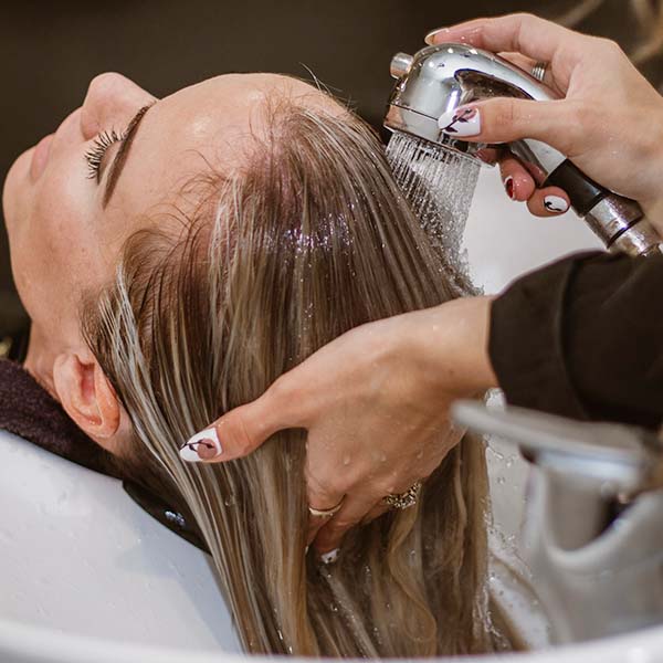 Reducing water in hair washing