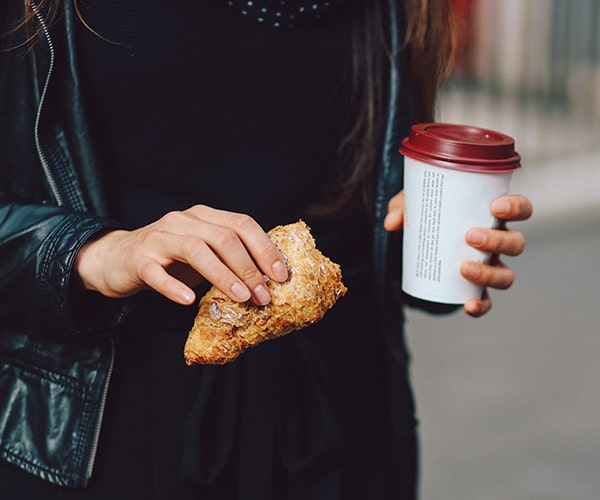 Person with takeaway food and drink