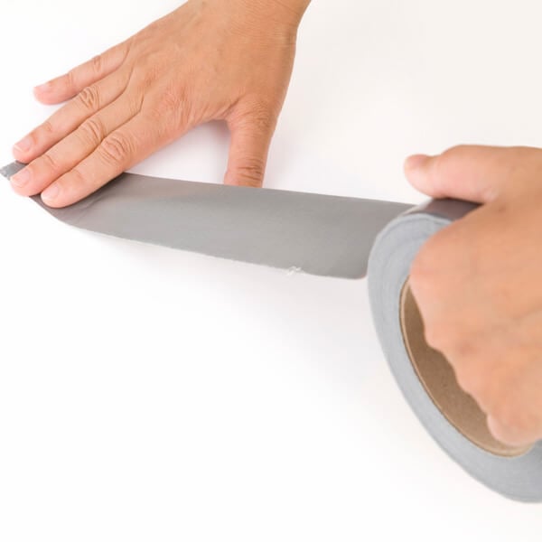 Applying adhesive tape from roll